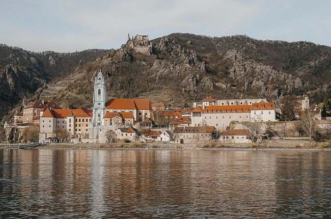Dürnstein's blue tower and the castle ruin on the bare rock in late autumn
